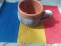 Handmade traditional Romanian objects placed on the Romanian flag and on a handmade carpet during the loom